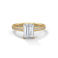 Front face view showing a 4 CT emerald cut lab diamond centered on a yellow gold pave accent band.
