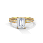 Front face view showing a 4 CT emerald cut lab diamond centered on a yellow gold pave accent band.