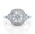 Front-facing render of a vintage-inspired 3 CT cushion cut lab grown diamond engagement ring with a milgrain halo and baguette side stones on a white background.
