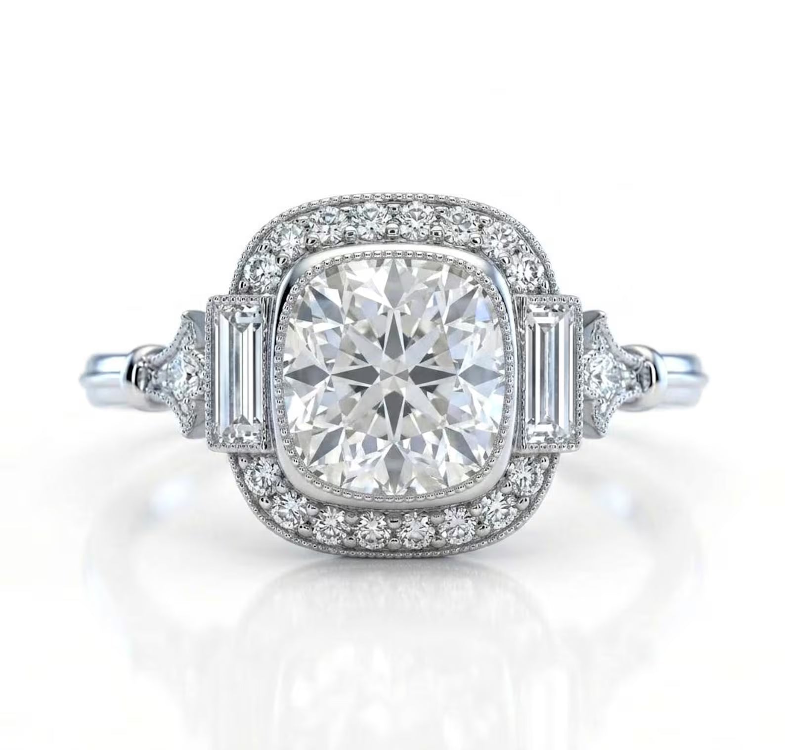 Front-facing render of a vintage-inspired 3 CT cushion cut lab grown diamond engagement ring with a milgrain halo and baguette side stones on a white background.
