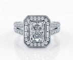 Front-facing top view of a 3 CT radiant cut lab grown diamond engagement ring with a geometric halo and milgrain split shank on a white background.