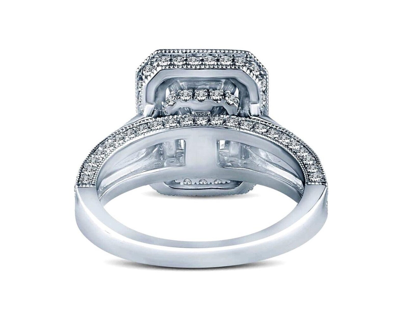 Underneath view of a 3 carat radiant cut ring revealing the open gallery, solid craftsmanship, and diamond detailing along the lower edges of the setting.