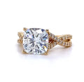 Direct top-down view of a stunning 4 carat cushion cut diamond engagement ring showcasing its brilliant facets and the yellow gold infinity diamond band.