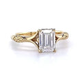 Direct front view of a 3 carat emerald cut lab grown diamond solitaire ring featuring intricate vintage-inspired engraved shoulders.