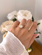 Full hand view showcasing the eye-catching profile and size of the horizontally set oval diamond ring.