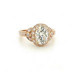 Top-down view highlighting the sparkling 3 CT oval lab created diamond center stone and halo