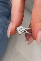 Close-up view of a 2 CT princess cut lab grown diamond in a diagonal compass setting with a split double pavé band