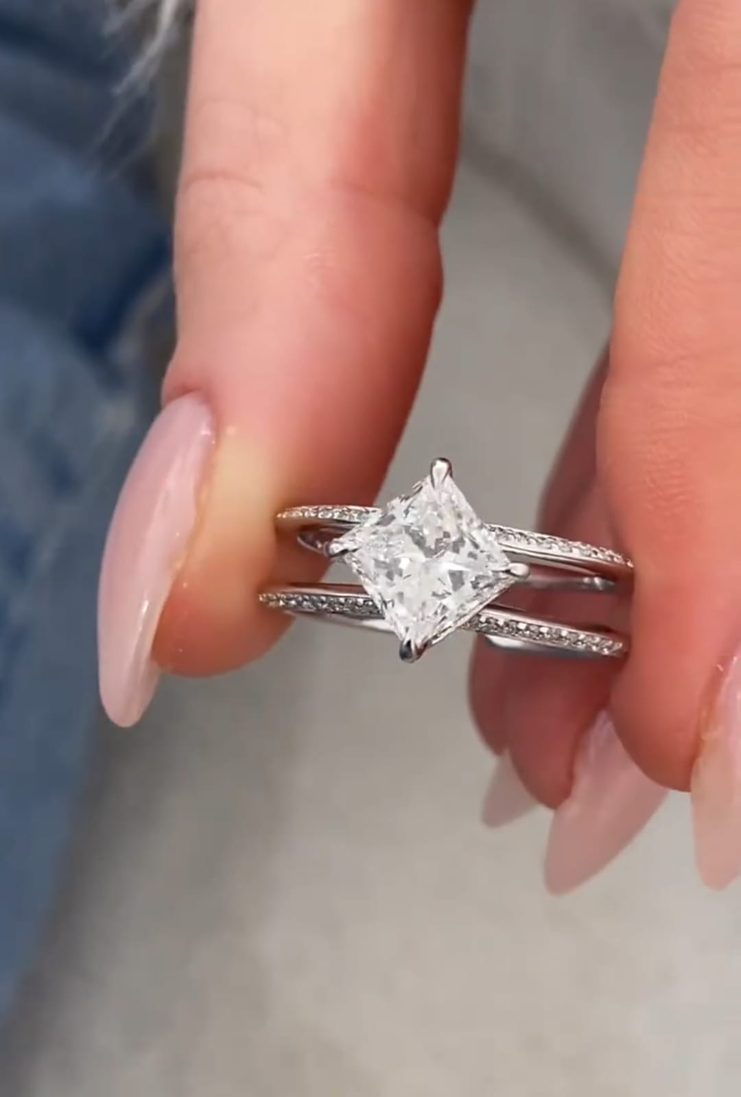 Detailed shot showing the diagonal kite-set 2 carat princess cut lab diamond and pavé encrusted white gold bands