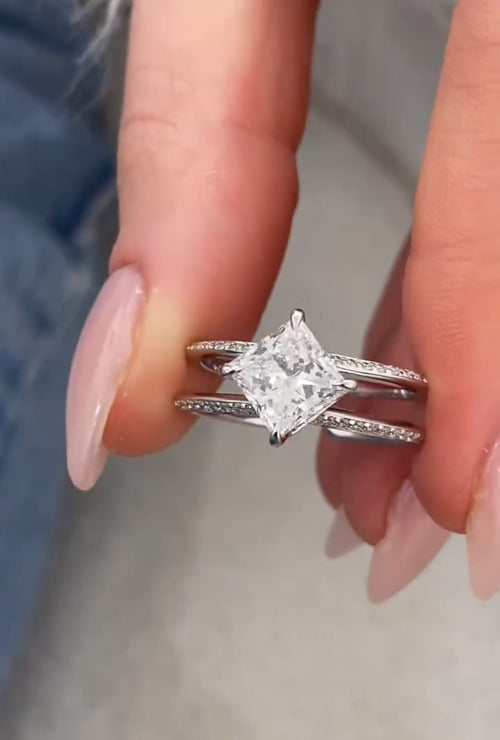 Detailed shot showing the diagonal kite-set 2 carat princess cut lab diamond and pavé encrusted white gold bands