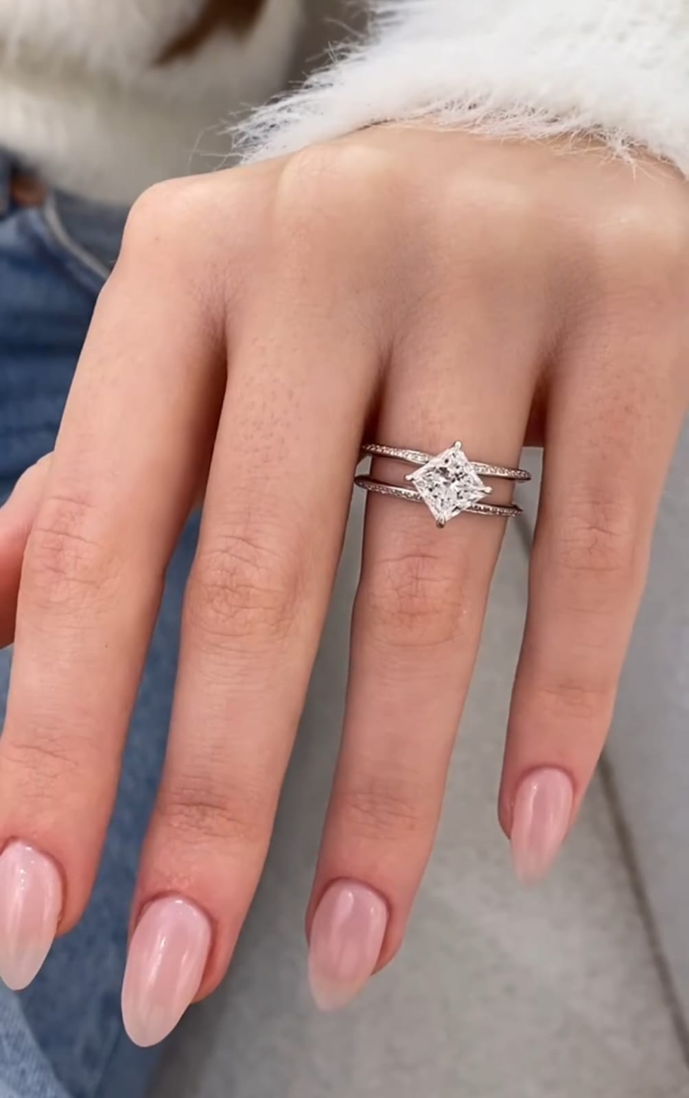 On-hand view of a 2 CT diagonal princess cut lab grown diamond ring with double pave band