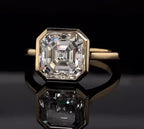 Top-down reflection shot highlighting the step-cut facets of a 4 carat Asscher lab diamond ring
