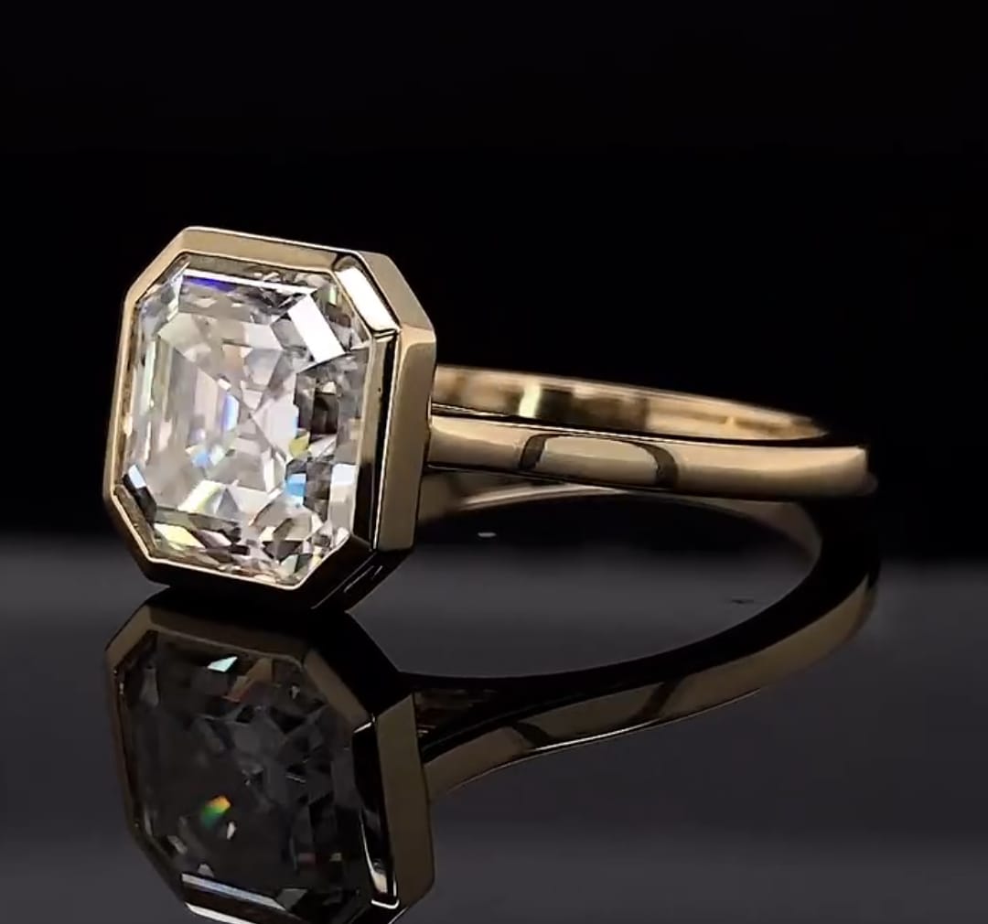 Angled view showcasing the octagonal bezel frame and brilliance of the 4 CT Asscher cut lab diamond