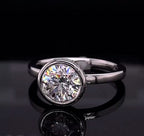 Front reflection view highlighting the round brilliant cut facets of a 3 CT lab diamond bezel ring