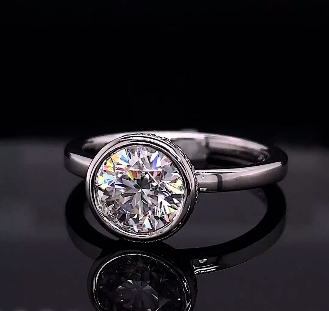 Front reflection view highlighting the round brilliant cut facets of a 3 CT lab diamond bezel ring