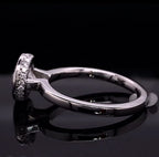 Complete side profile displaying the polished white gold band and pavé encrusted bezel basket