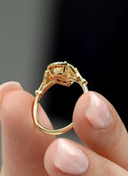 Under-gallery view highlighting the craftsmanship and yellow gold setting of a pear diamond halo ring