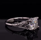 Side view showing the detailed vine and leaf engraving on the shank of a 3 CT cushion diamond ring