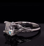 Angled side profile showing the vine-wrapped prongs and brilliance of the 3 CT cushion lab diamond
