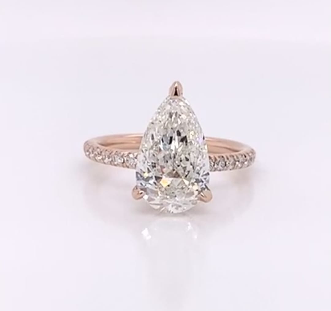 Direct top view showcasing a brilliant 4 carat pear cut lab grown diamond in rose gold