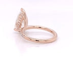 Profile view displaying the subtle hidden halo underneath the 4 CT pear cut center diamond