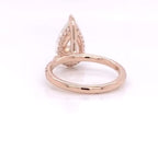 Rear under-gallery view showing the rose gold band and hidden halo setting of a pear diamond ring