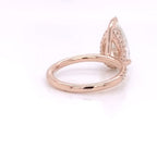 Side profile view highlighting the thin rose gold band and high-set 4 CT pear diamond