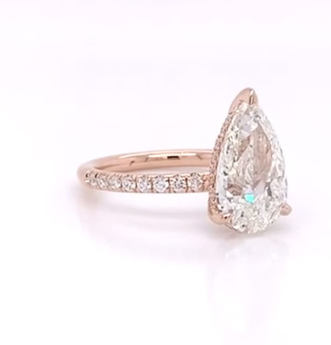 Three-quarter angle view emphasizing the sparkle and clarity of a 4 CT pear lab diamond
