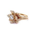 Angled view showing the intricate sparkle of the micropavé petals and split shoulder setting