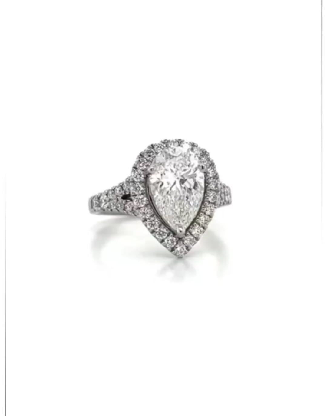 Direct top view showcasing a brilliant 3 carat pear cut lab grown diamond in a halo setting