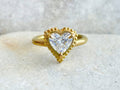 Direct top view showcasing a brilliant 2 CT heart shape lab grown diamond in a granulated beaded halo frame