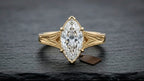 Front view showcasing the brilliance and symmetry of a 3 CT marquise cut lab grown diamond in yellow gold
