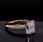 Side profile view highlighting the claw prong setting and cathedral lift of a 3 CT emerald cut diamond ring