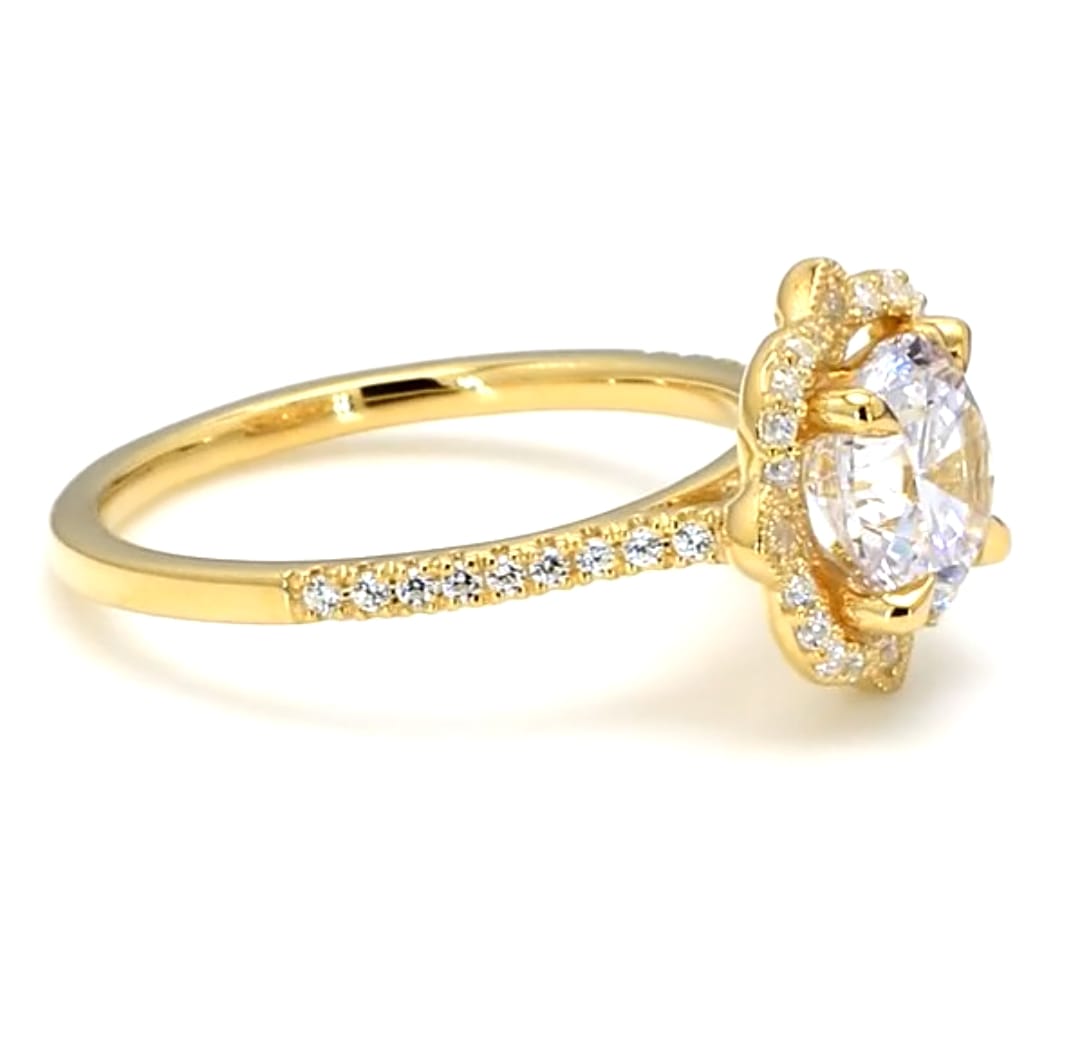Side profile view showing the elevated floral setting and micro-pave diamond band in gold.