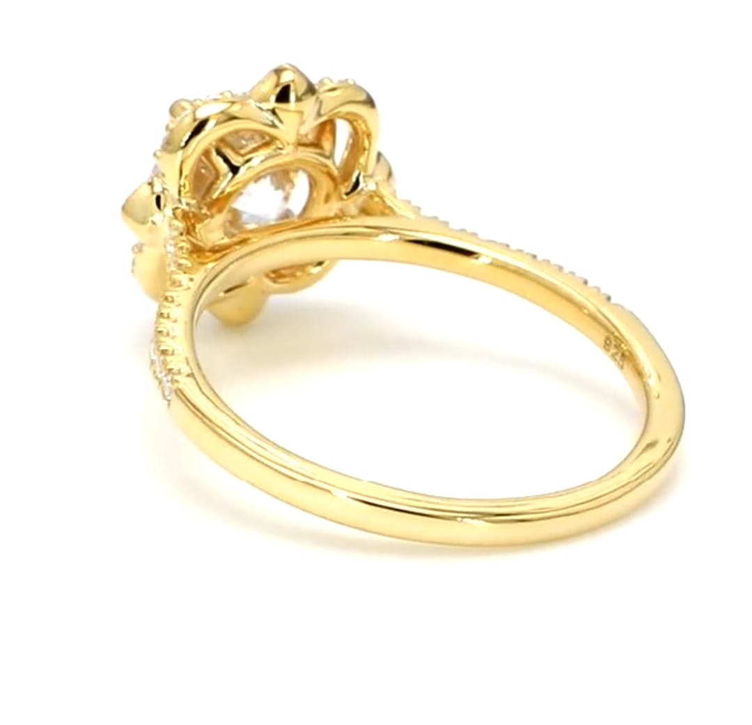 Interior view of gold engagement ring band displaying metal purity hallmark stamp.