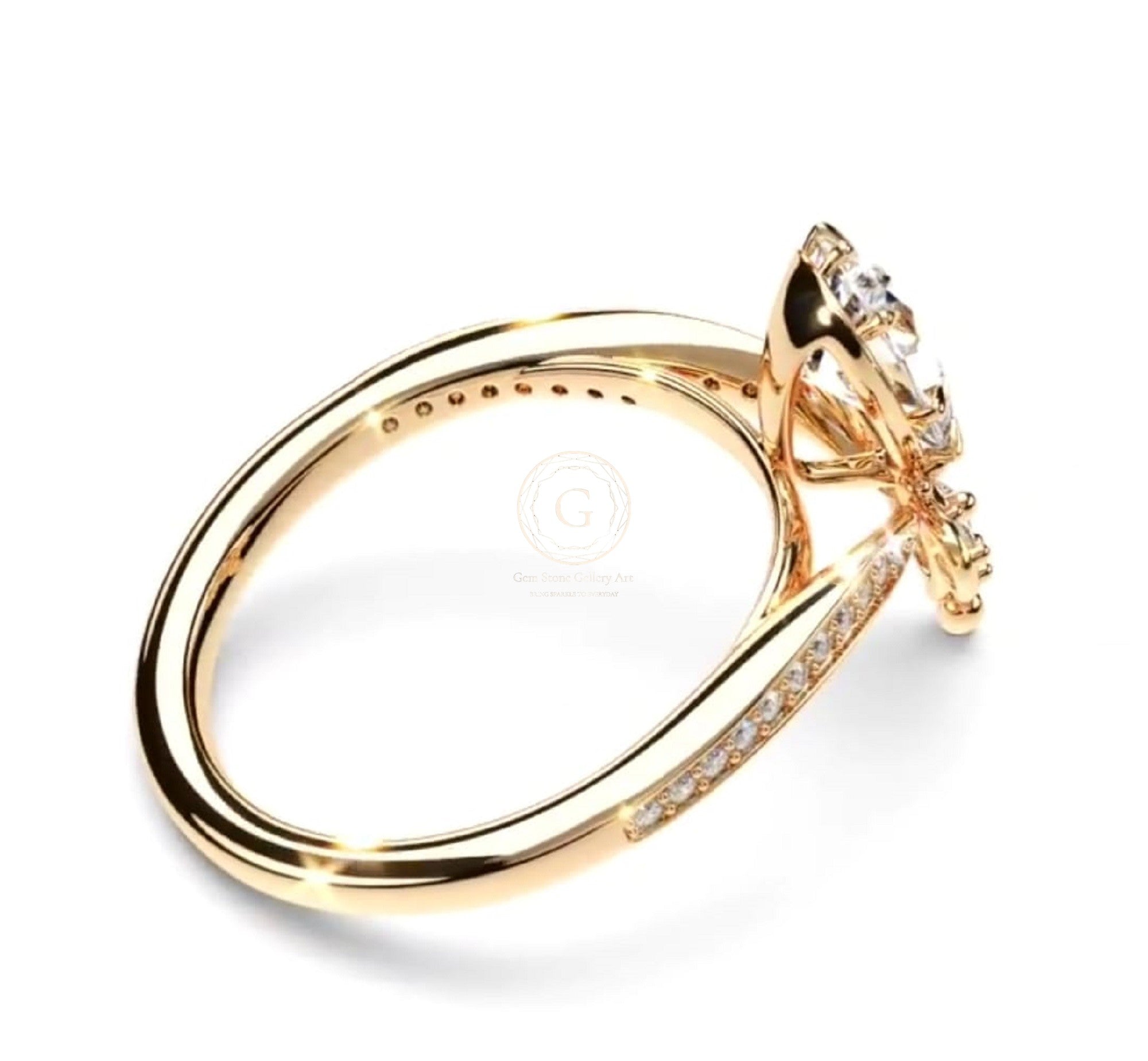 Side profile of a 2 Ct pear-cut lab-grown diamond engagement ring showing gold band with accent pavé diamonds and intricate setting.