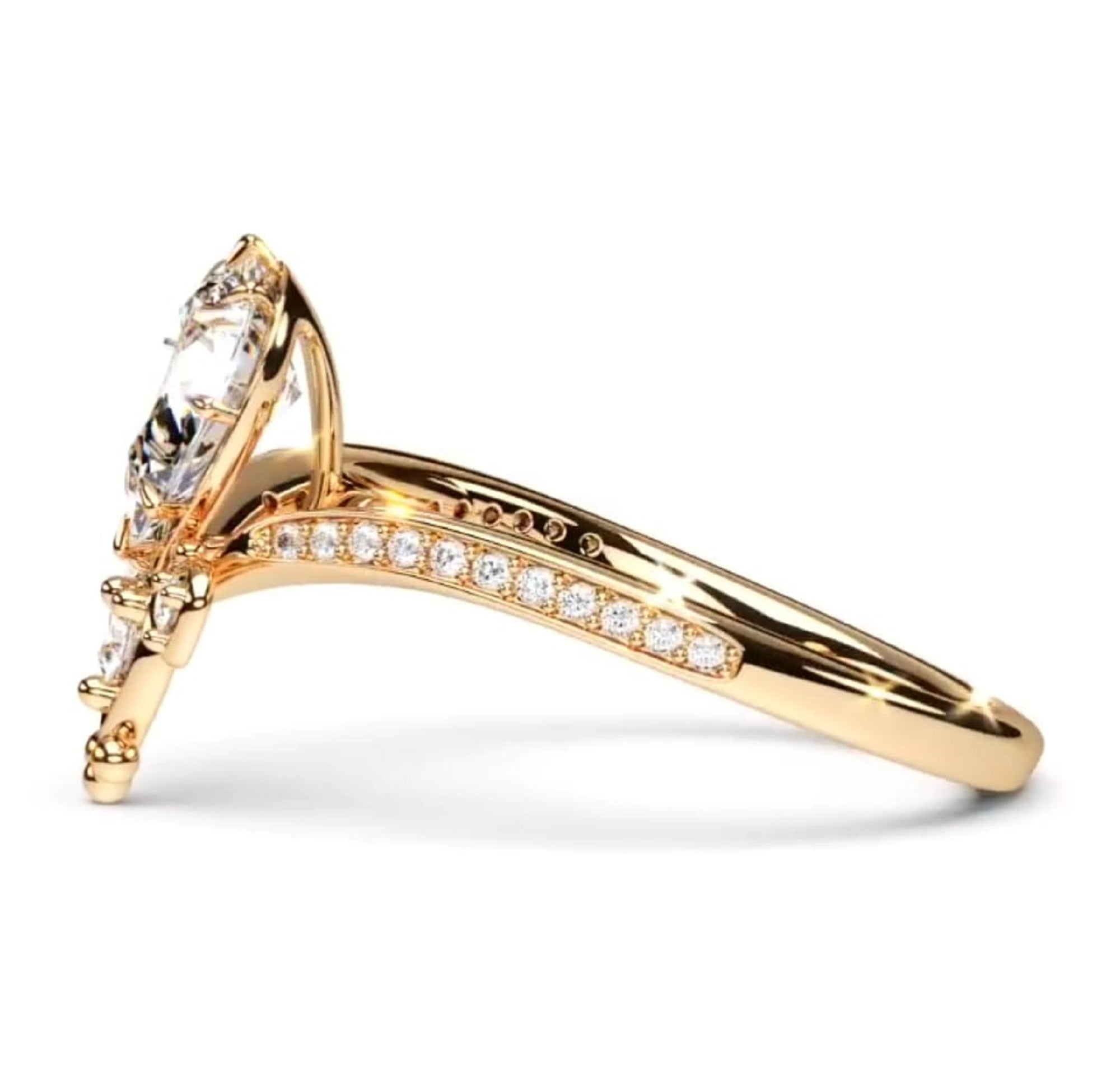 A yellow gold ring with a Pear-cut clear center stone and pavé-set round diamonds along the shank
