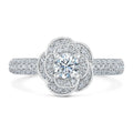Top-down view highlighting 1.5 CT round cut lab grown diamond set inside a blooming rose halo with pave band.