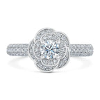 Top-down view highlighting 1.5 CT round cut lab grown diamond set inside a blooming rose halo with pave band.
