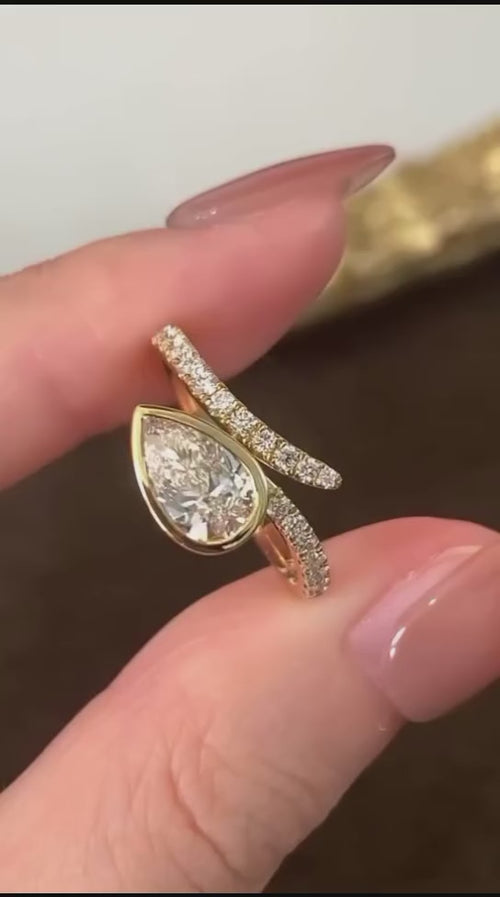 1.5 CT Pear Cut Lab Grown Diamond Bezel Bypass Ring in 14K Gold